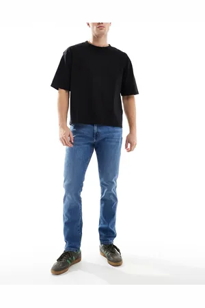 Wrangler Larston - Smalle jeans i tapered fit og lys vask-Blå