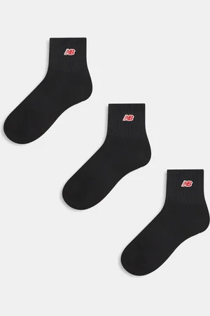 New Balance Pakke med 3 par sorte ribstrikkede sokker med rødt logo