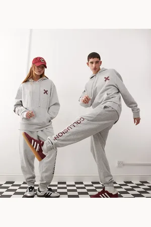 COLLUSION Unisex - Gråmelerede joggingbukser med logo og bordeauxrødt print