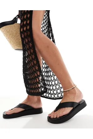 Schuh Tanisha - Sorte klipklappere med flatform-sål i læder