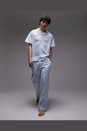 Lacoste Loungewear - Lyseblå bukser med gennemgående krokodilleprint