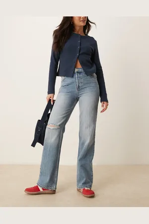 Free People Holly - Blå bootcut-jeans med slitage på knæene