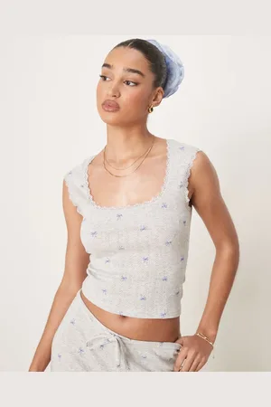 Gina Tricot Mix og match - top i bomuld med broderet kant og blåt sløjfe-print