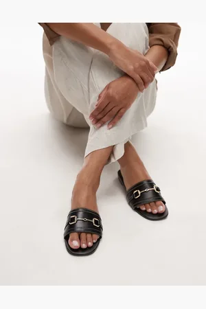 MANGO Sorte mule-sandaler med guldfarvede detaljer