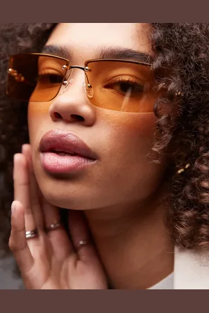 Le Specs Alien - Uindfattede firkantede solbriller med guldfarvet stel og ravfarvede glas