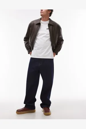 Carhartt Landon - Mørkeblå løstsiddende jeans i tapered pasform