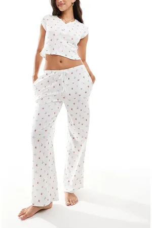 Kaiia Mix og match - Cremehvide pyjamasbukser med vide ben og småblomstret print i pointelle-strik-Multifarvet