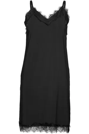 Freequent Dress From Freequent In A Light Fabric. The Dress Is Simple In Its Design With T Black