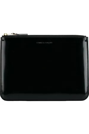 Comme des Garçons Clutch i læder med præget logo