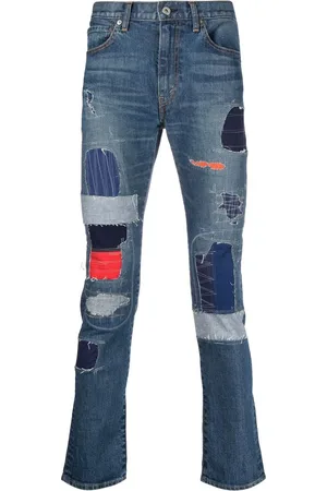 JUNYA WATANABE Jeans med patchwork og smal pasform