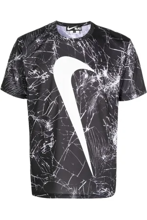 Comme des Garçons T-shirt med swoosh-tryk