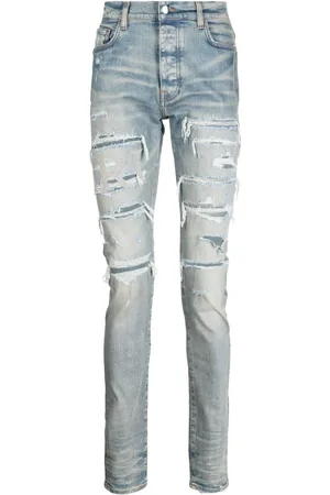 AMIRI Varsity skinny-jeans med slitageeffekt