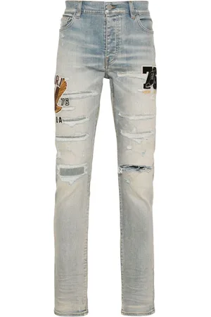 AMIRI Logo-appliqué skinny jeans