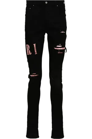 AMIRI Behandlede skinny-jeans med logoapplikation