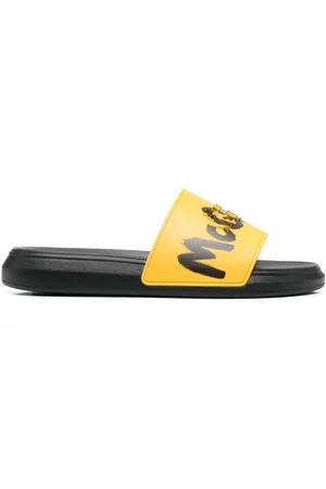 Alexander McQueen Slip-on sandaler med graffiti-logo