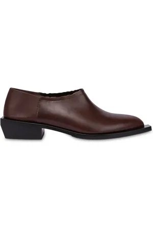 Moschino Loafers i læder med takket kant