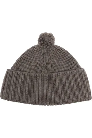 Fursac Hue med pompon-detalje