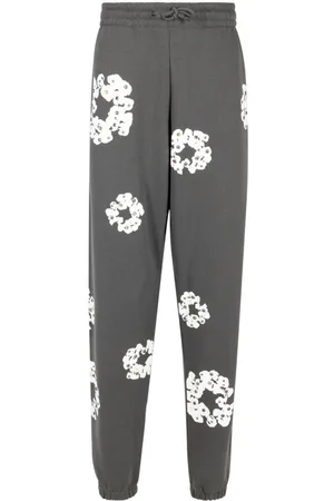 DENIM TEARS Joggingbukser med rhinsten og Wreath-tryk