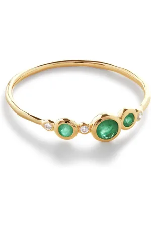 Monica Vinader East West ring i 14 karat guld med baguetteslebet diamant og smaragd