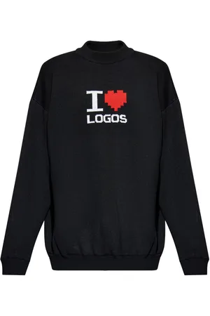 Vetements Intarsiastrikket sweater med slogan