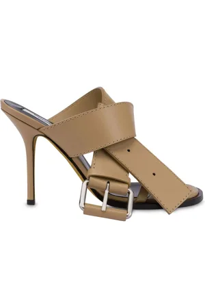 Moschino Mules i læder med dekorativt spænde
