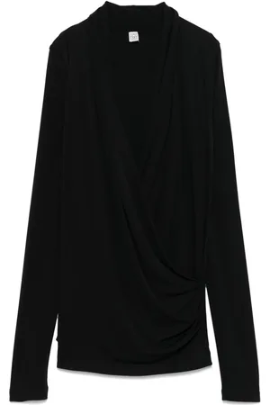 Totême Bluse i jersey med overlag