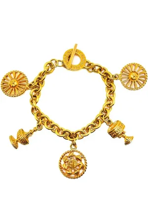 JENNIFER GIBSON JEWELLERY Guy Laroche armbånd med vedhæng fra 1980