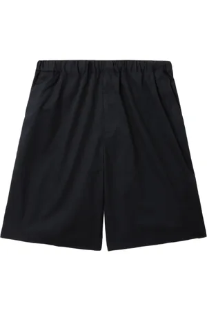 UNDERCOVER Shorts med logokant