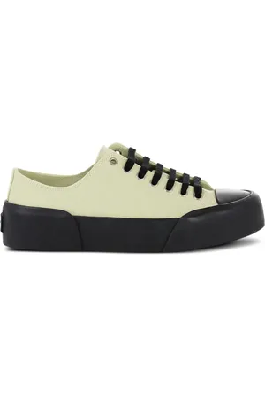 Jil Sander Sneakers i lærred med snøre