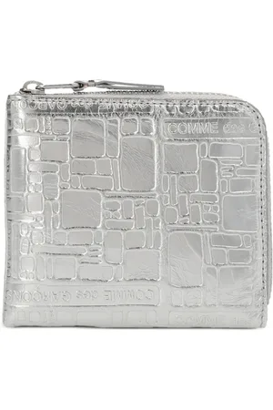 Comme des Garçons Embossed Logo