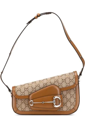 Gucci Asymmetrisk Horsebit 1955 skuldertaske i GG-kanvas fra 2016-2024