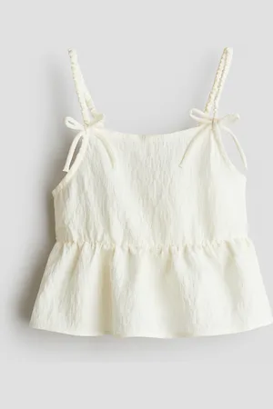 H&M Peplumtop med sløjfedetalje