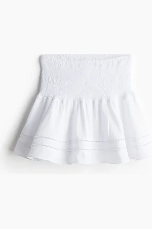 H&M Mininederdel med smocksyet talje