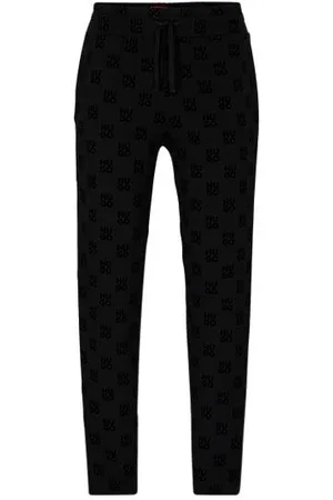 HUGO - Straight-leg tracksuit bottoms with flock-print stacked logos