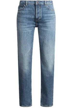 HUGO BOSS Jeans med tapered fit i blå denim med en slidt effekt