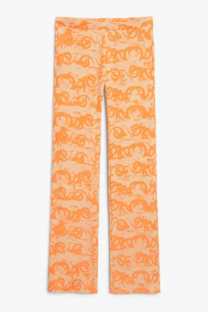 Monki Low waist orange flared trousers