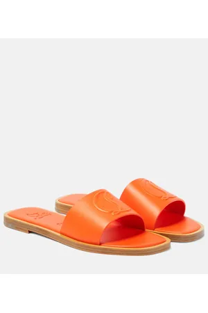 Christian Louboutin CL embossed leather mules
