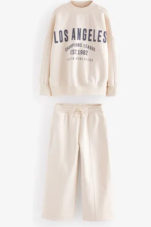 Next Slogan Sweatshirt og Brede bukseben joggersæt (3-16år)9 år (134cm)