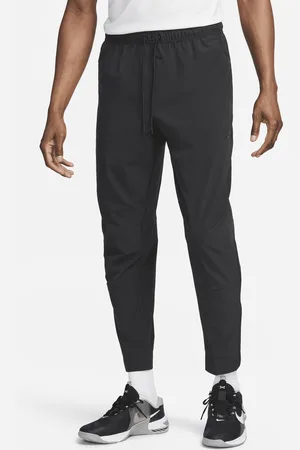 Nike Alsidige Unlimited-Dri-FIT-bukser med lynlåsmanchetter til mænd