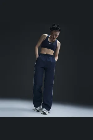 Nike Vævede Windrunner-bukser med høj talje og åben kant til kvinder